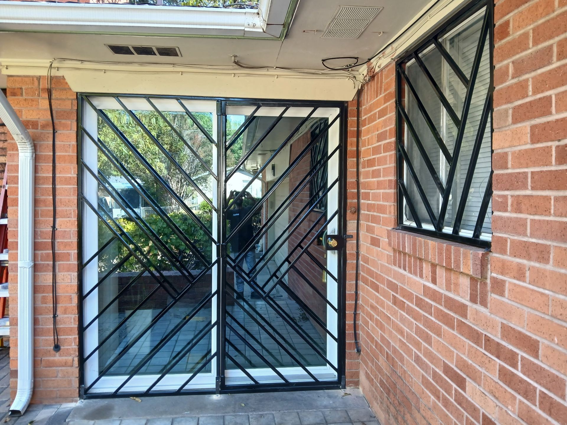 On-site Structural Welding Custom Designed & Painted Metal Framed Doors